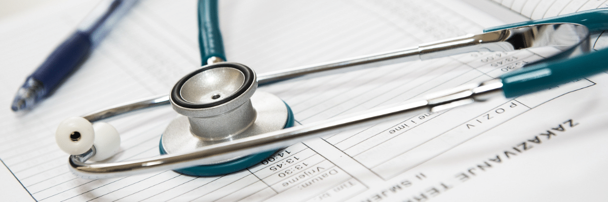 A stethoscope resting on a medical form.